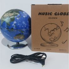 Musical rotating globe with lighting on a stand